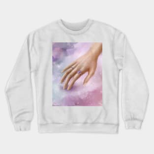 Female Hand With Purple Rings Touching a Soft Purple Fabric Crewneck Sweatshirt